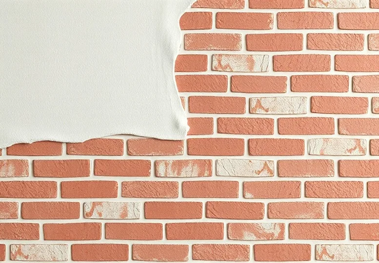 Application d'un enduit décoratif à la lisseuse sur un mur